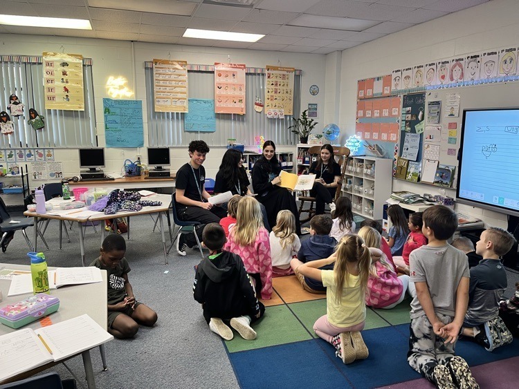 JBHS students visit FAWE to read to students