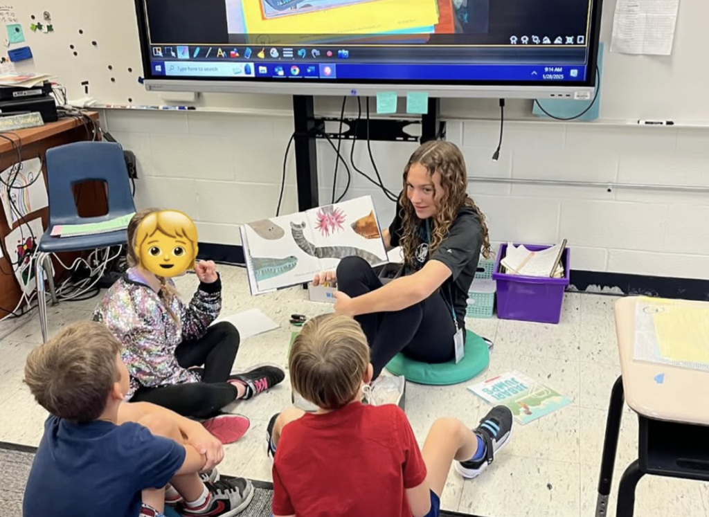JBHS students visit FAWE to read to students