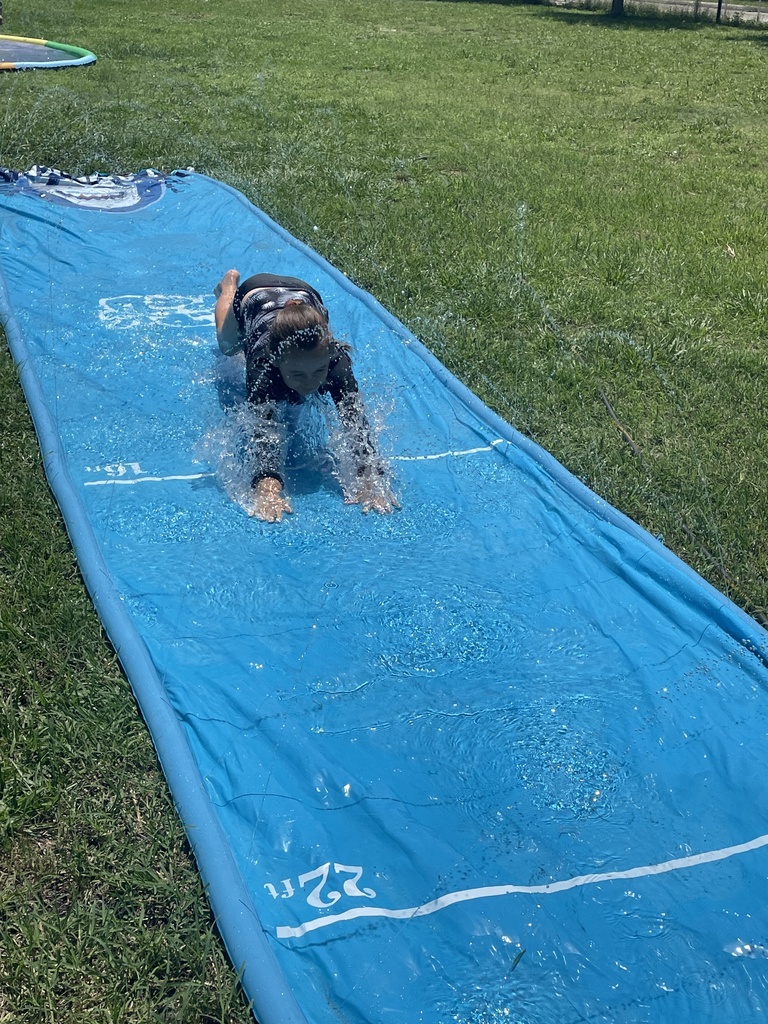 HSE Extended Day campers have a water day outside
