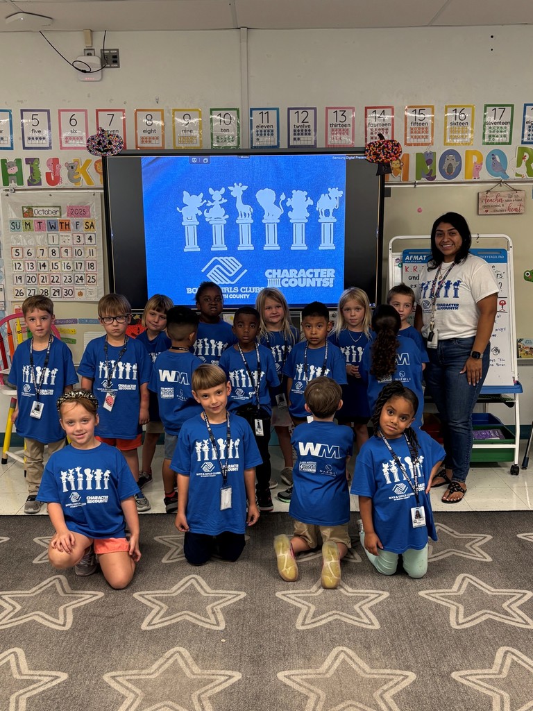 Ms Baza's class sits proudly.