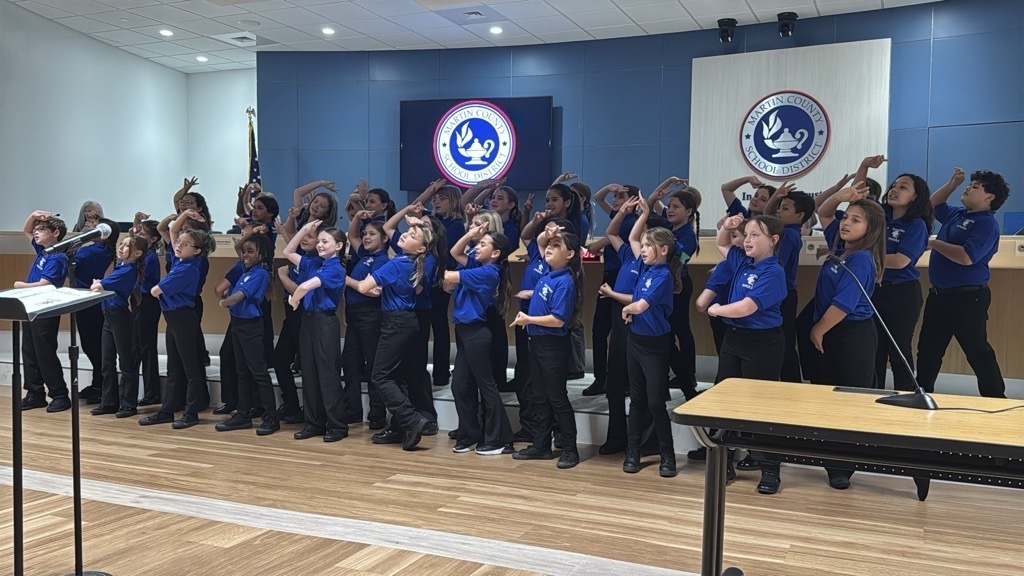 FAWE Sailfish Singers at school board meeting