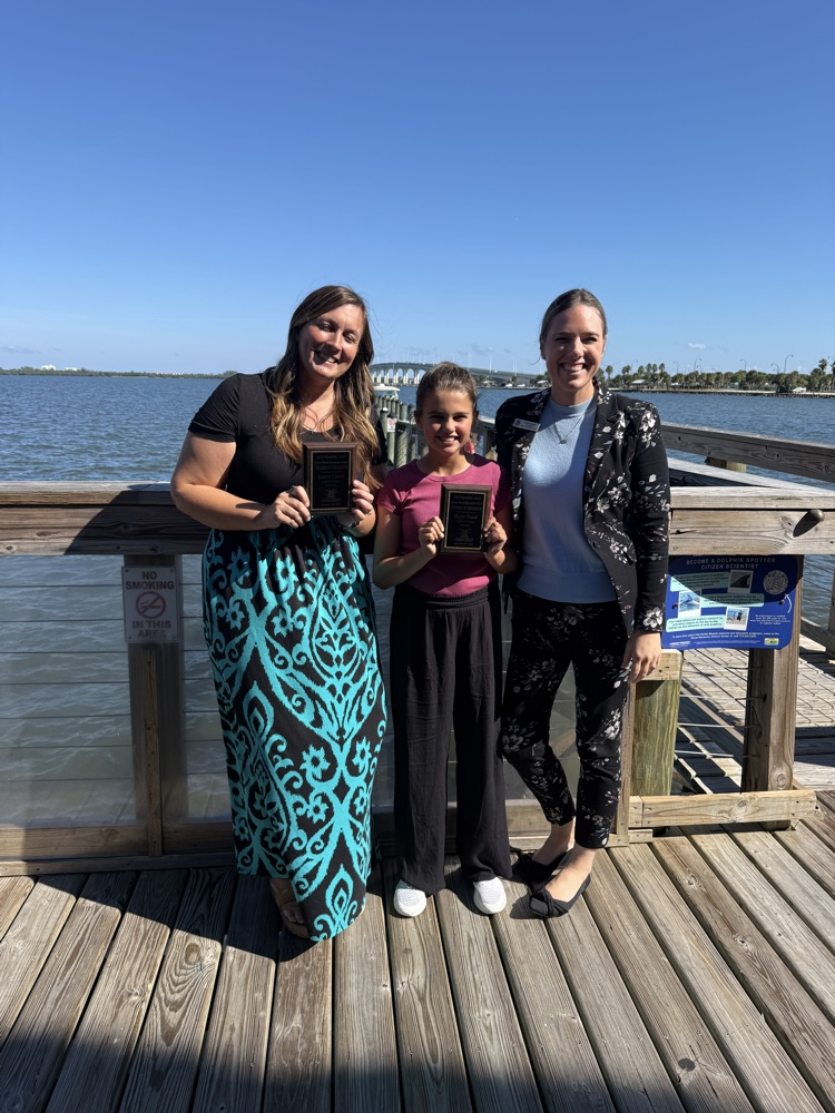 Teacher and Student of the Month with Principal Smith