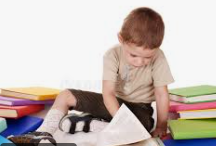 Boy reading stack of books