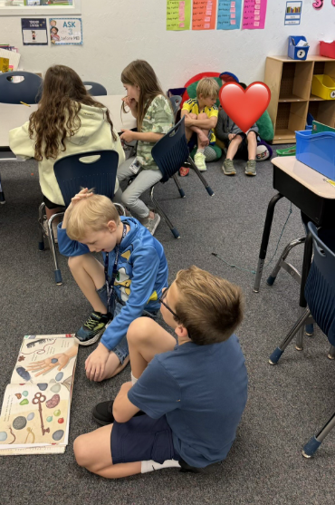 2026 Literacy Week - Ms. Cagni's fourth grade reading with Ms. Thompson's first grade