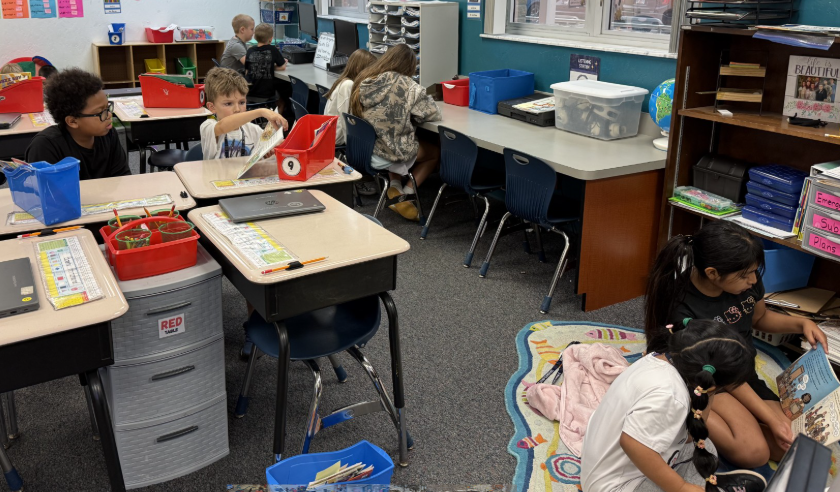 2026 Literacy Week - Ms. Cagni's fourth grade reading with Ms. Thompson's first grade 4