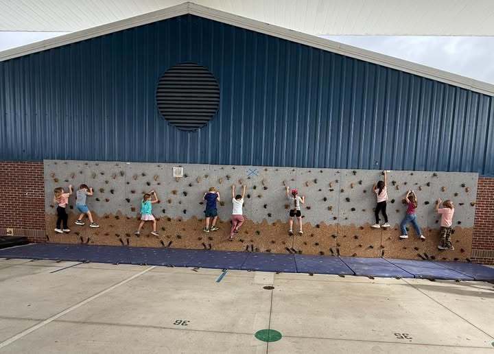 students rock climbing