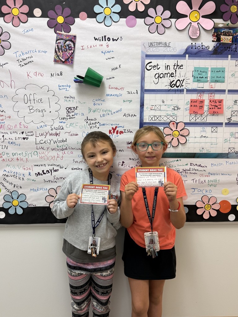 3rd grade classmates celebrating hard work.