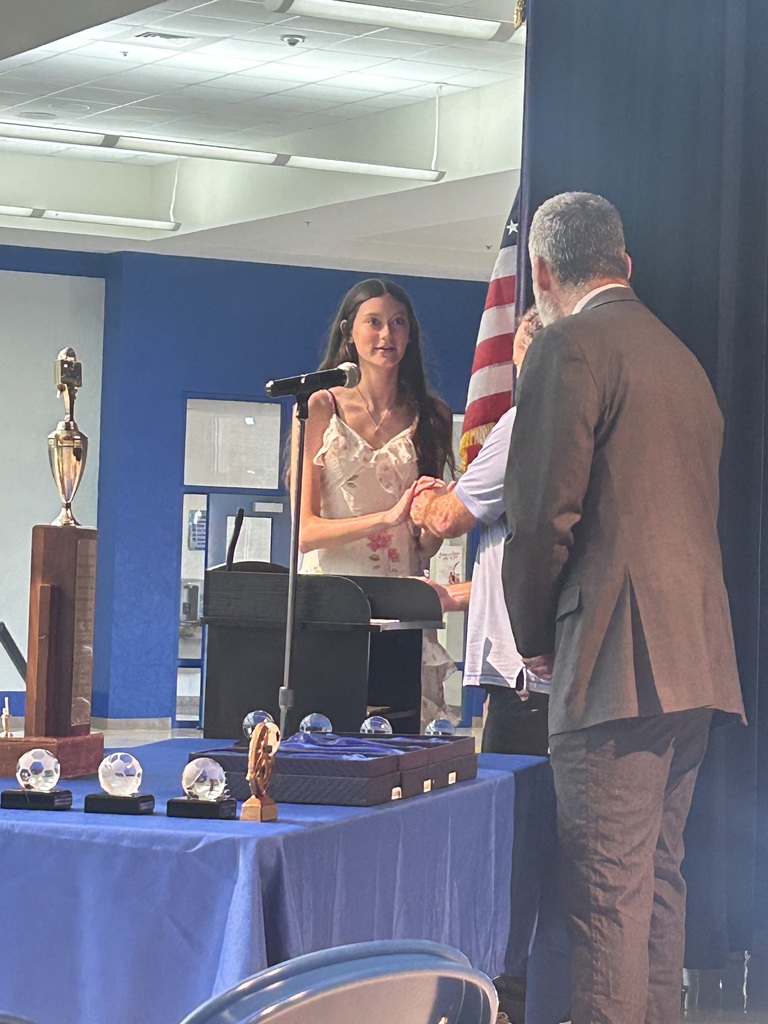 Bristol Chasse accepts an award