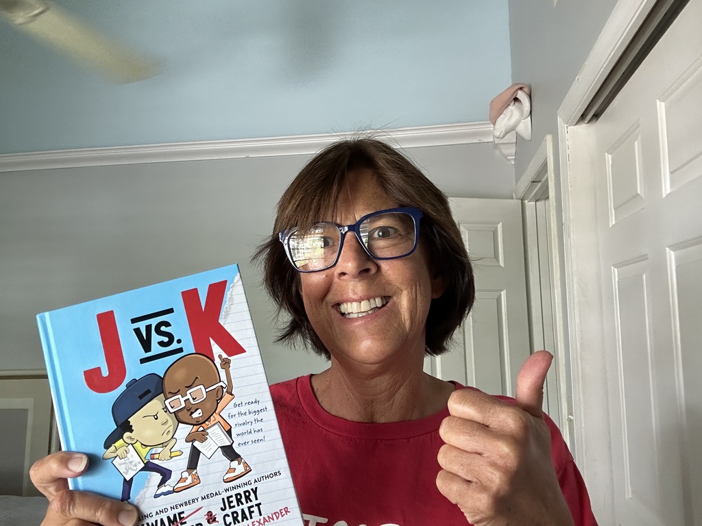 Mrs. Parrilli gives a Thumbs up for J vs K
