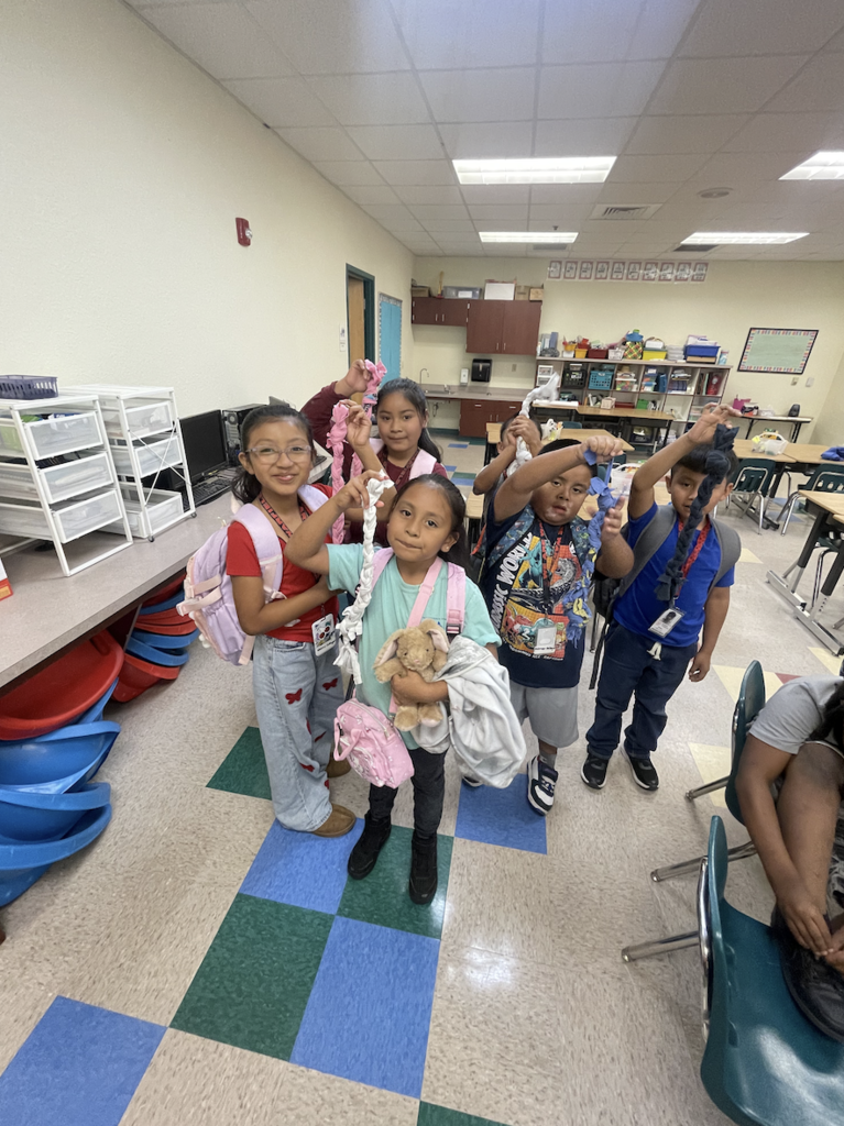 Students create cat toys as part of their summer learning service project