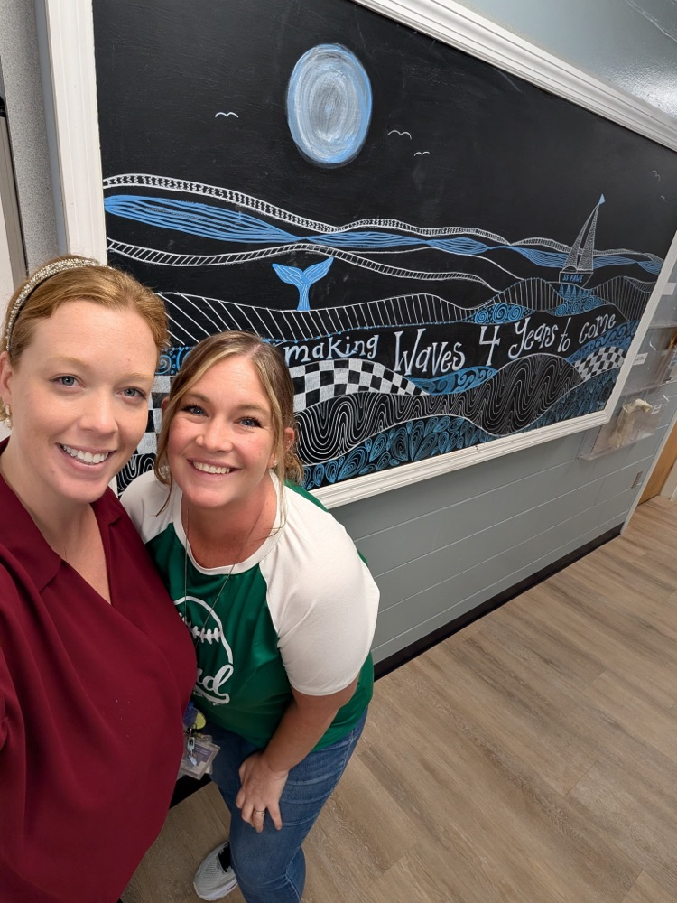 Mrs Urbay and Mrs Pryor with artwork