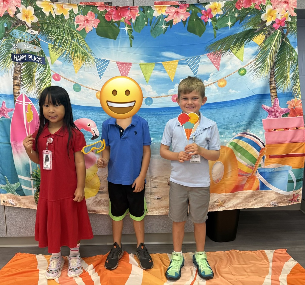 STAR Gators pose in front of a beach-themed backdrop.