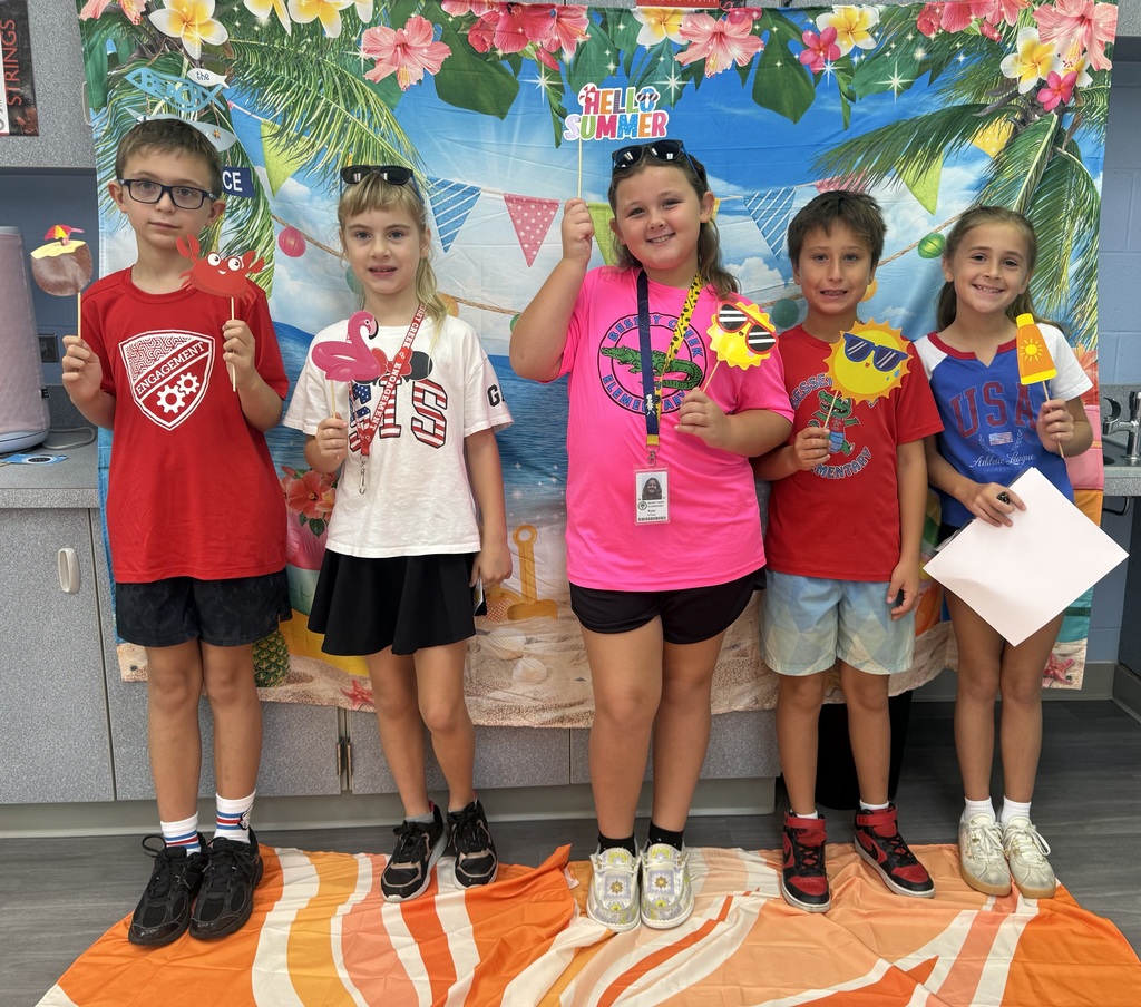 STAR Gators pose in front of a beach-themed backdrop.