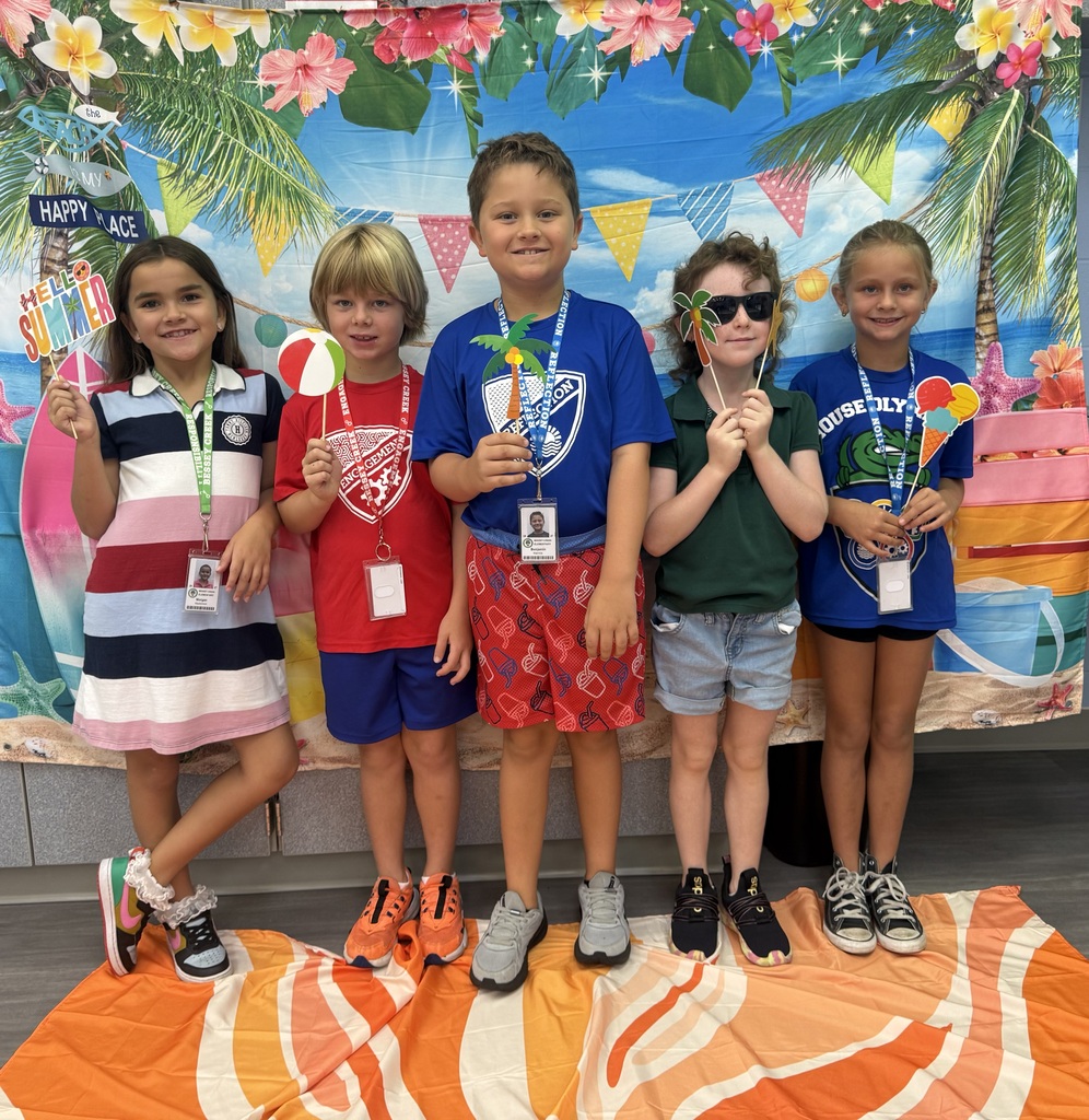 STAR Gators pose in front of a beach-themed backdrop.