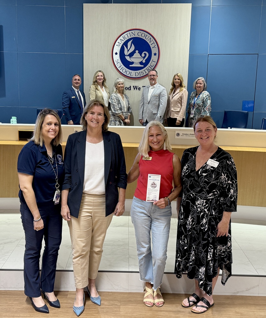 Members of the Martin County School Board pose with officials from the District office, the Library Foundation of Martin County and the Children's Services Council of Martin County
