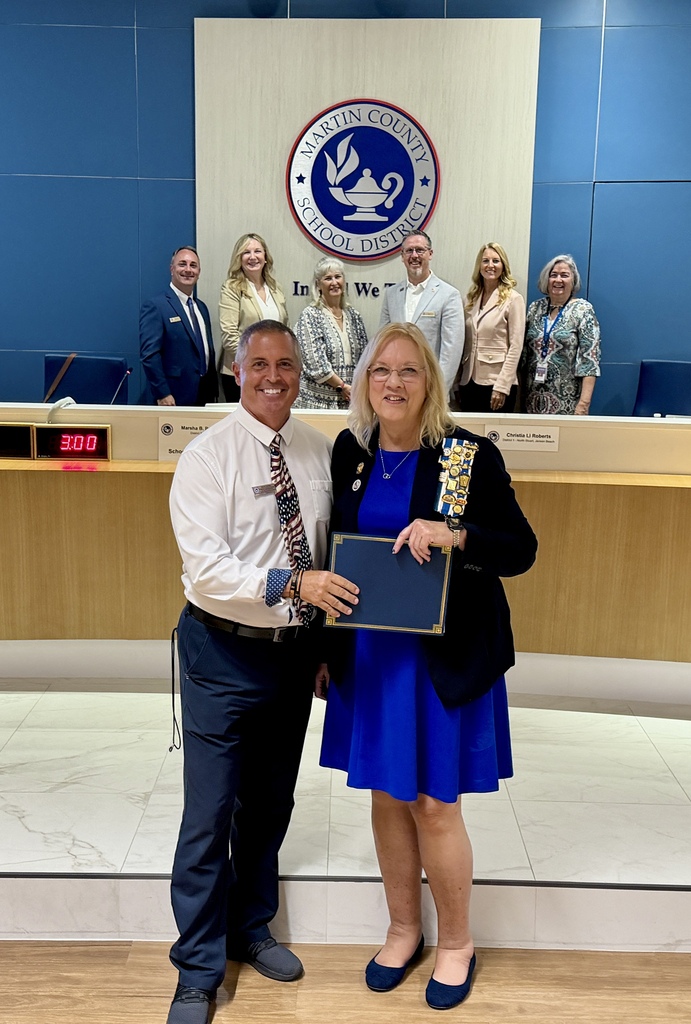 Martin County School Board Members pose for a picture with Mark Cowles and Rae Scimeca from the Halpatiokee Chapter of the Daughters of the American Revolution