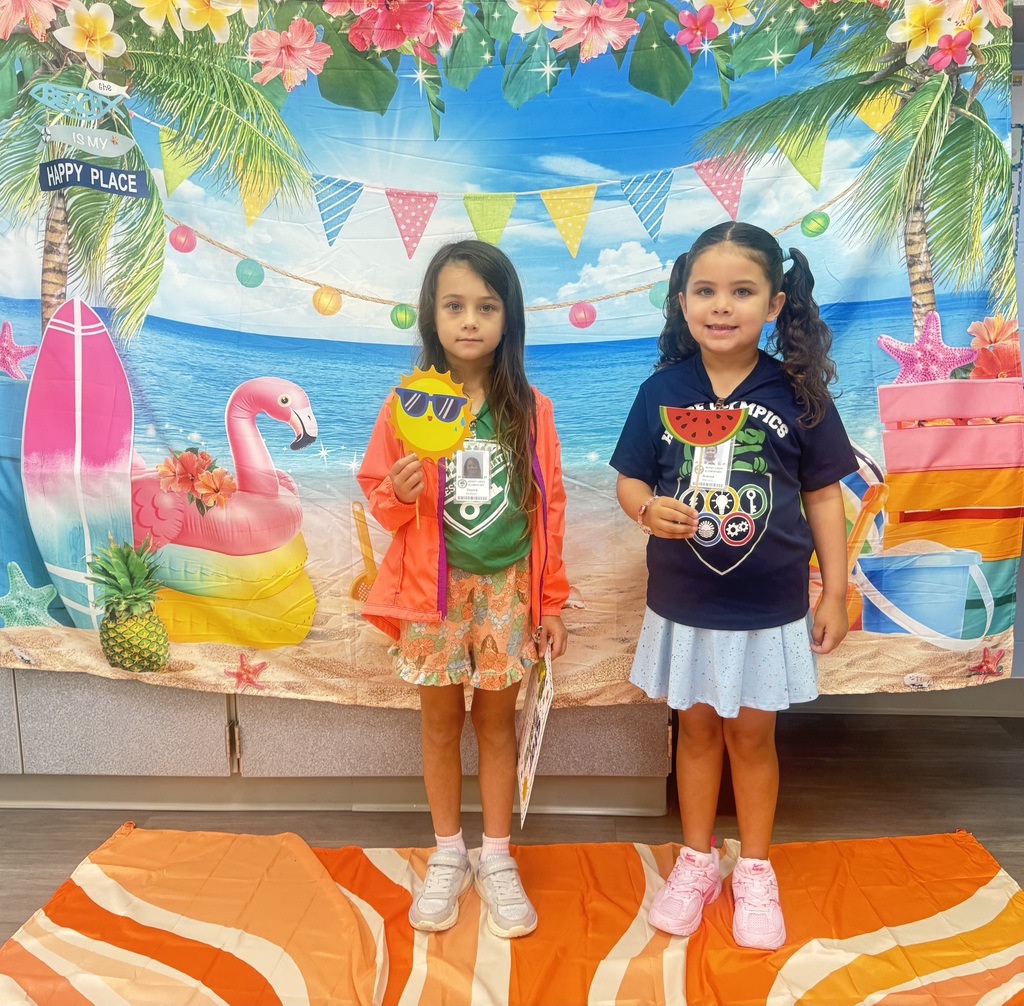 STAR Gators pose in front of a beach-themed backdrop.