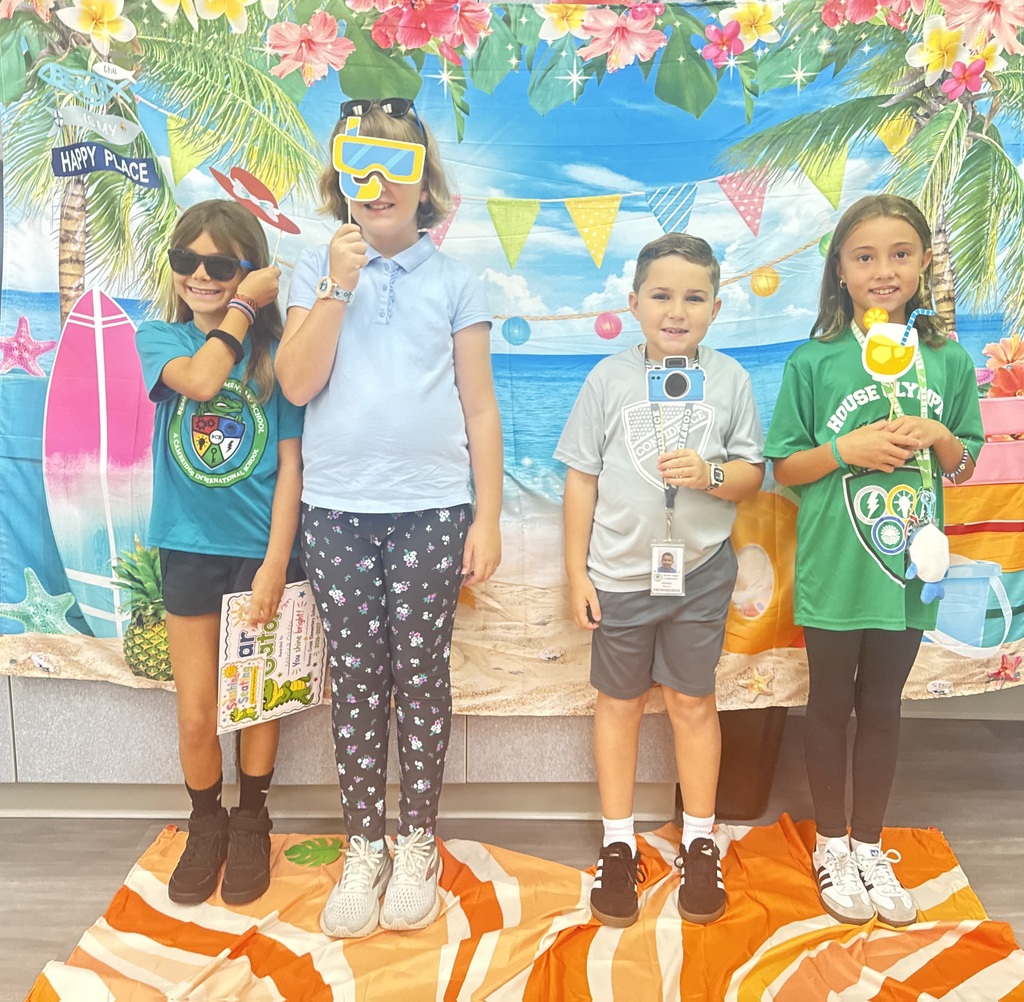 STAR Gators pose in front of a beach-themed backdrop.