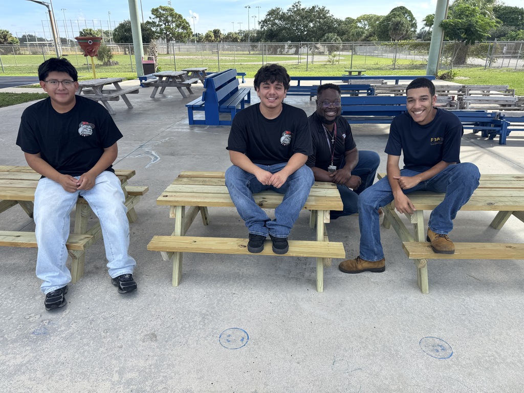 South Fork High School construction students smiling near the new picnic benches