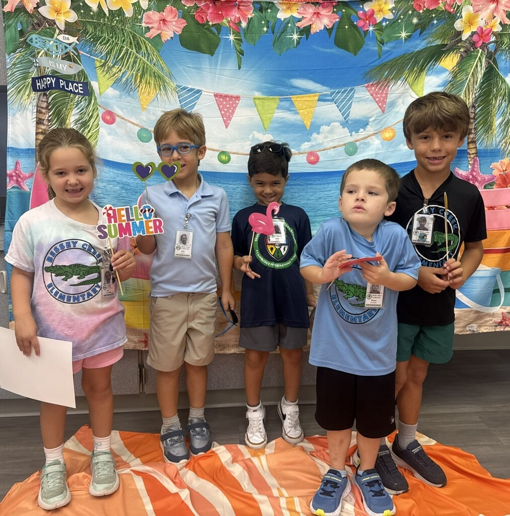STAR Gators pose in front of a beach-themed backdrop.