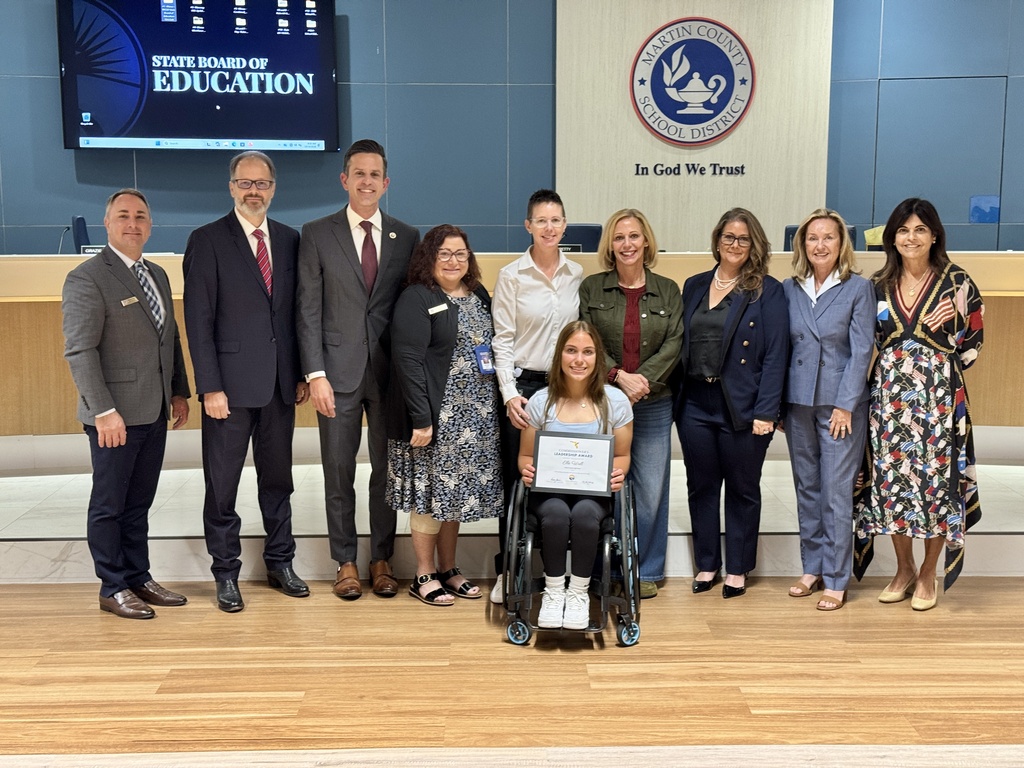 MCSD leaders and FLDOE Board members pose for picture with Elle Wall, MCHS senior