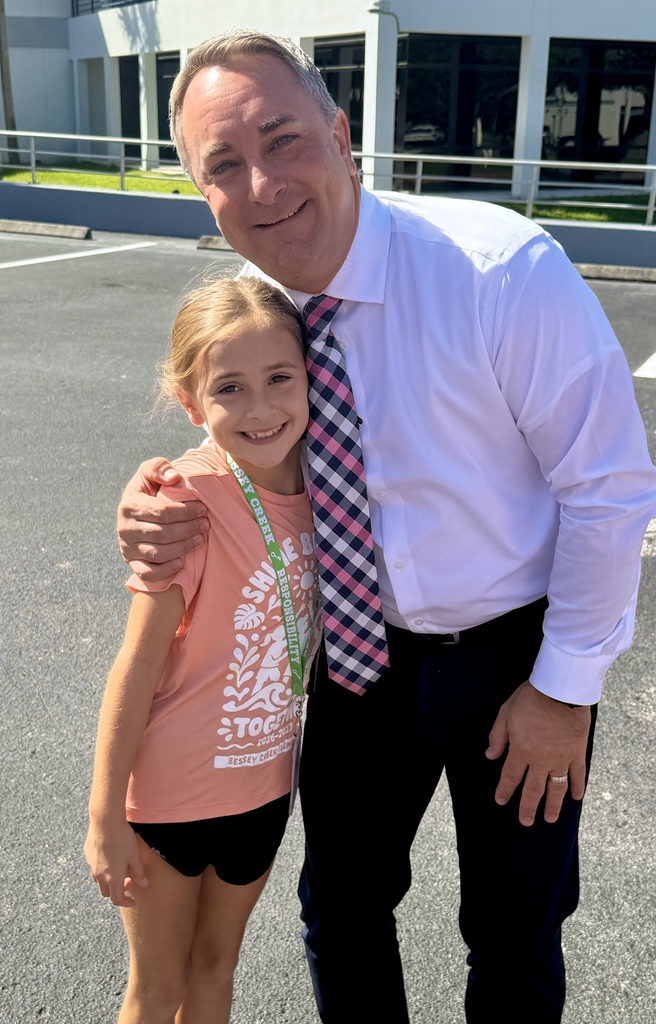Supt. Michael Maine and his third grade daughter outside the SDO as the class visits for a demonstration from Martin County Fire Rescue