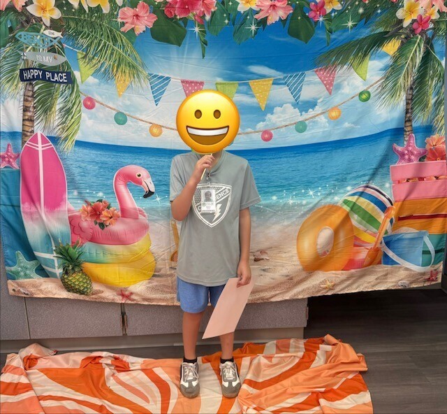 STAR Gator Students stand in front of a beach-themed backdrop.