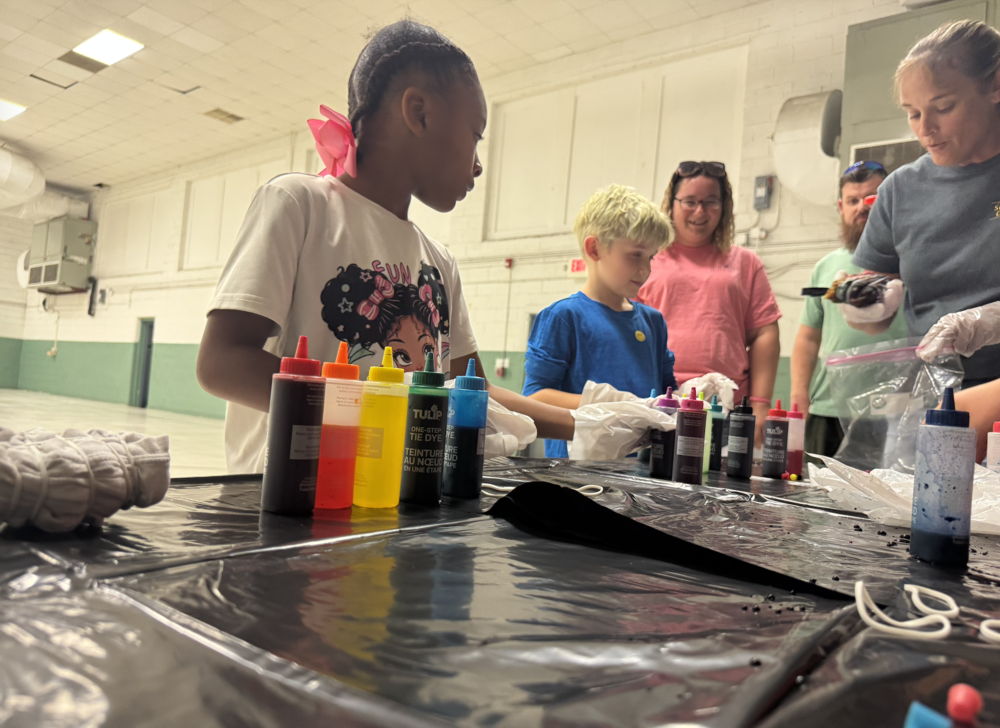 Tie Dye table with students and families