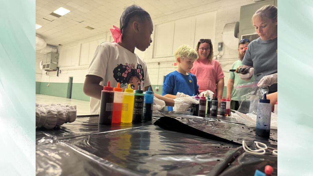 Tie Dye table with students and families