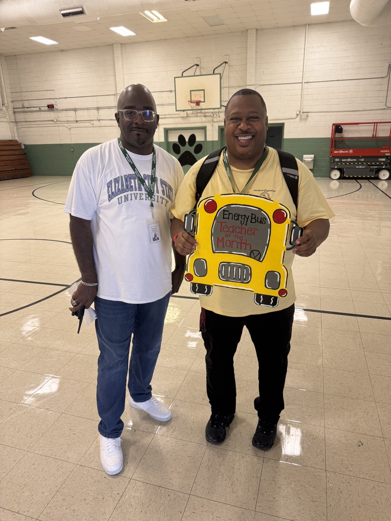 Mr. Locke smiling with Principal Howard