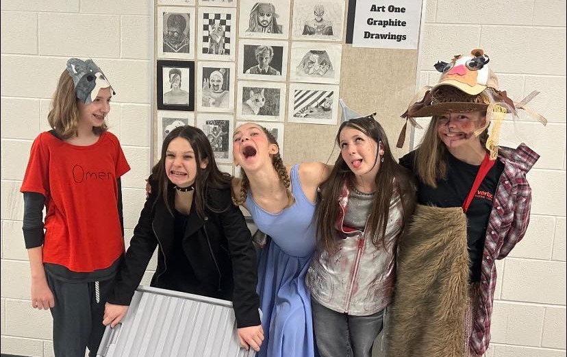 Odyssey of the Mind team makes silly faces while in their costumes