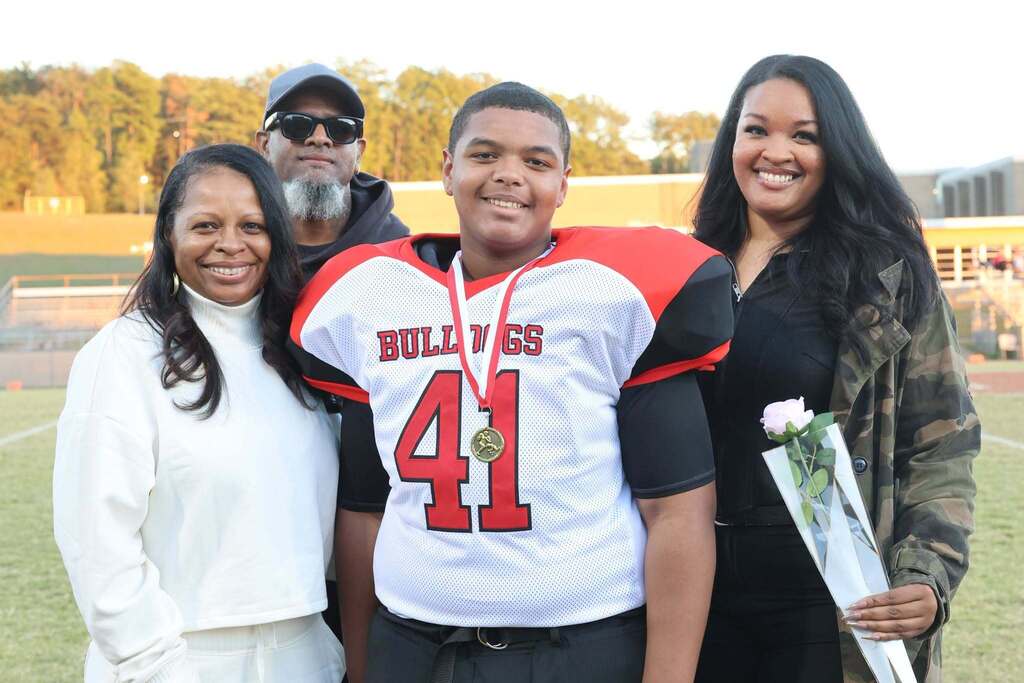 8th grade student-athlete with their family on MMS 8th grade night