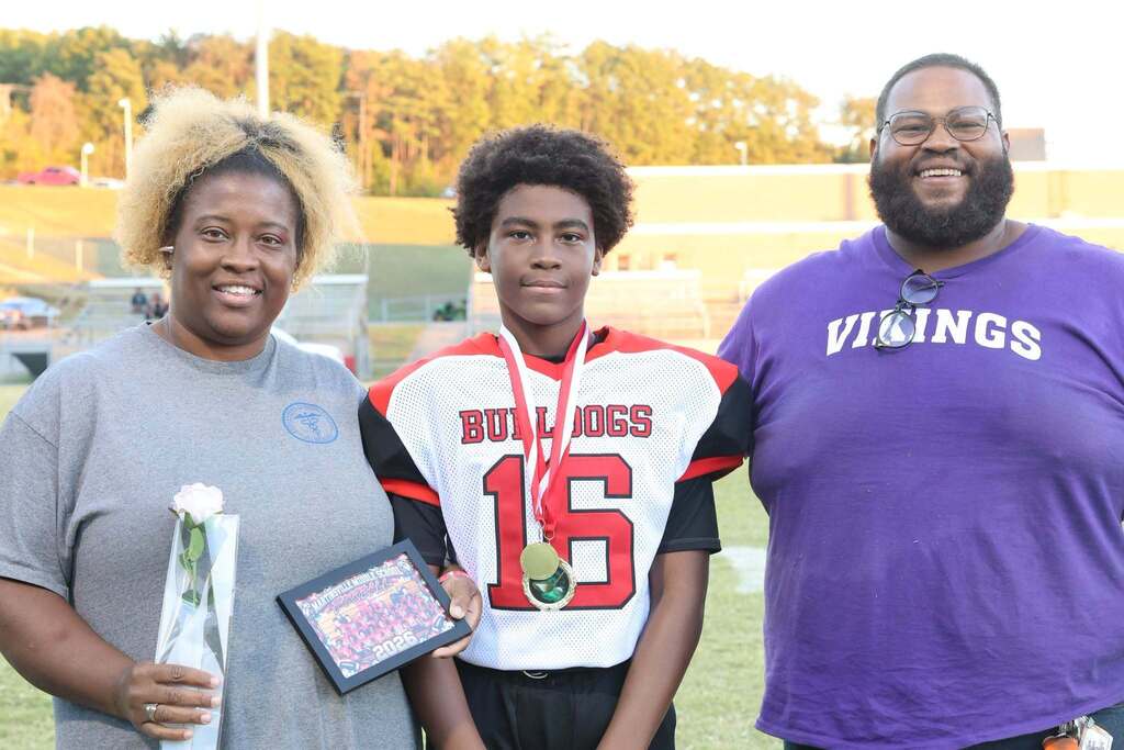 8th grade student-athlete with their family on MMS 8th grade night