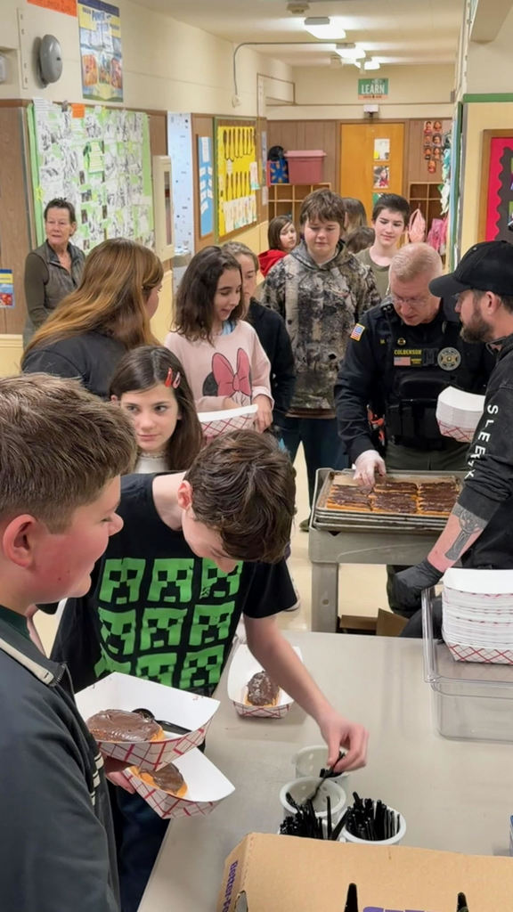 Deputy Matt Serving Breakfast to 6th Grade