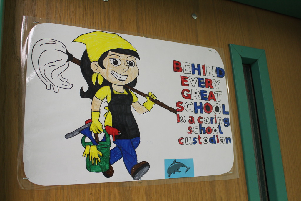 A drawing shows a custodian with the phrase "Behind every great school is a caring custodian"