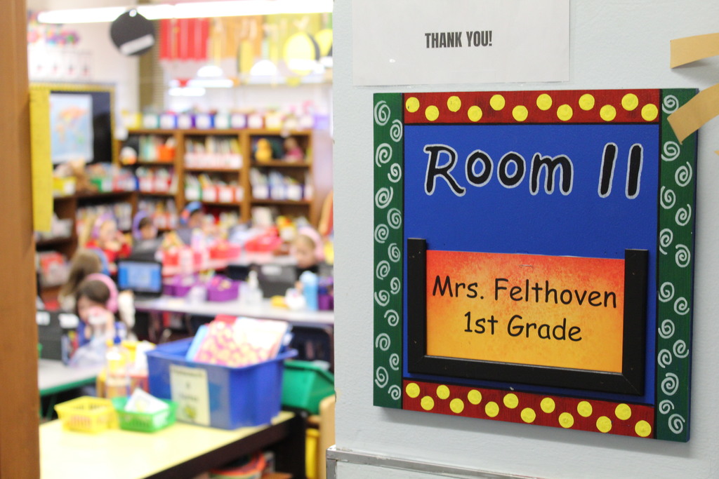 A colorful sign is seen outside a classroom 