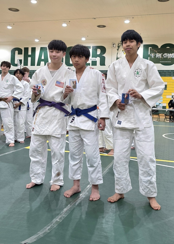 Photo of student with award at Judo Championships.
