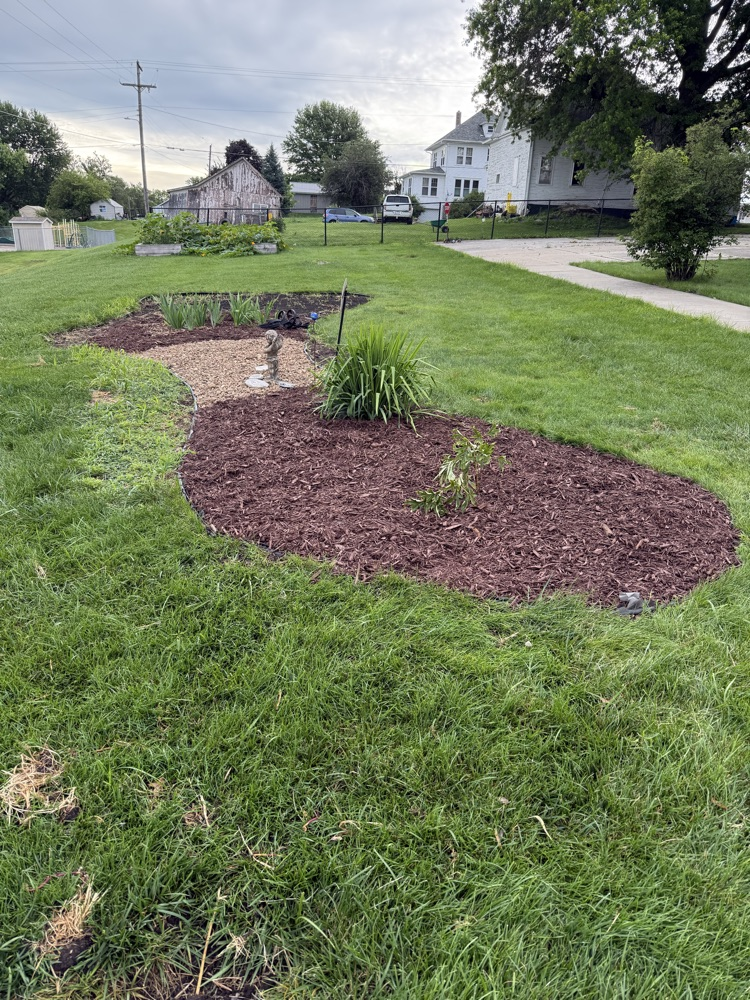 These ladies pulled weeds, restructured, laid tarps, spread rock, mulched and so much more.  