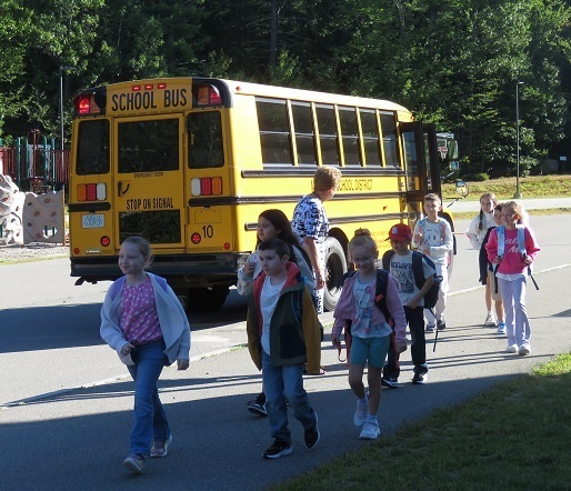Students getting off bus on first day of school