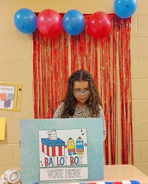 3rd Grader in Voting Booth