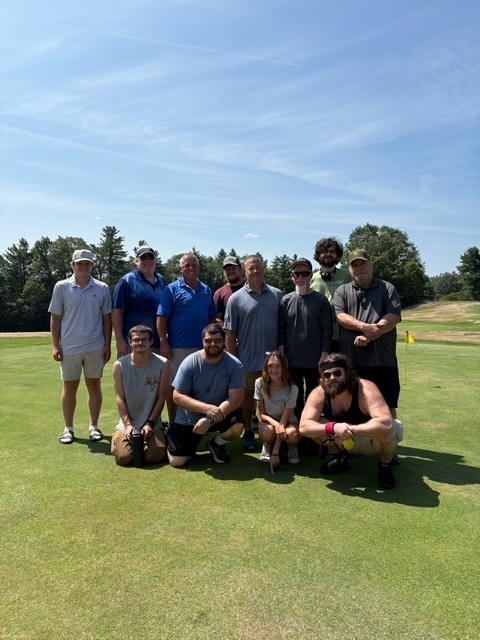 Picture of custodial staff on golf outing!