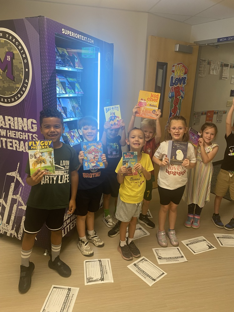 students holding books