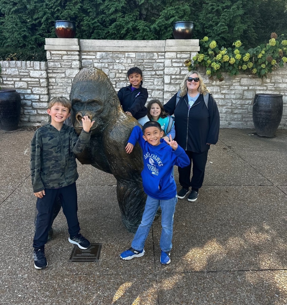 Kids climbing on a monkey 