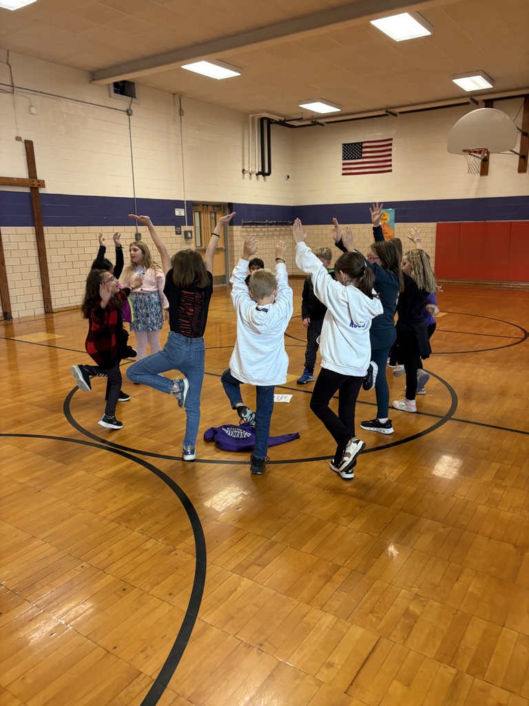 Students doing pumpkin yoga 