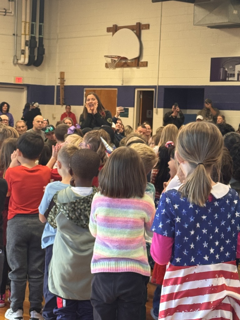 Mrs. C singing with the students.