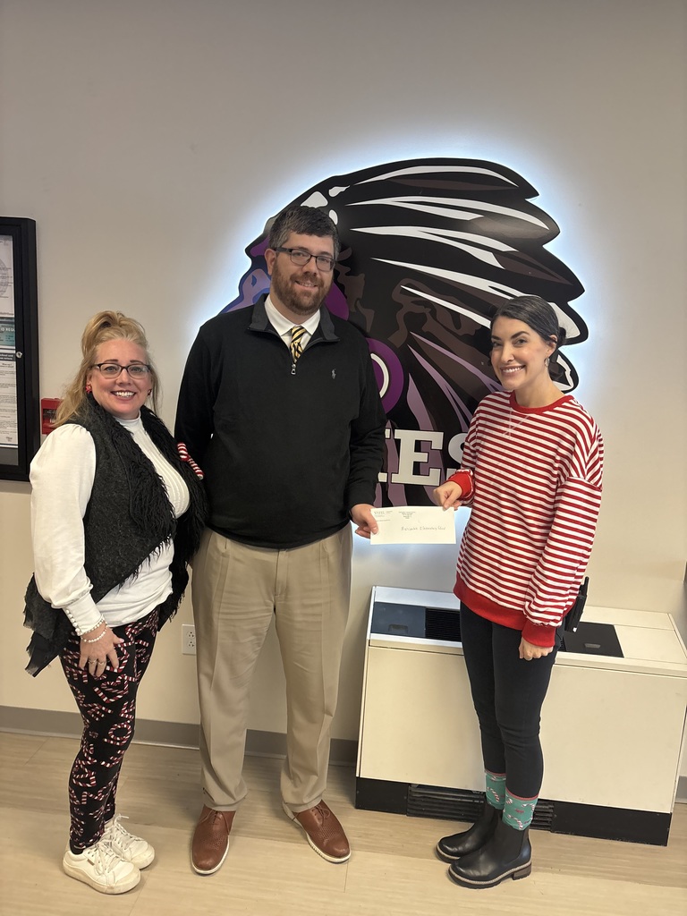 Check donated to the families of MES