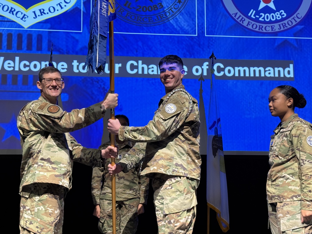 Cadet Santana accepting the guidon during the ceremony