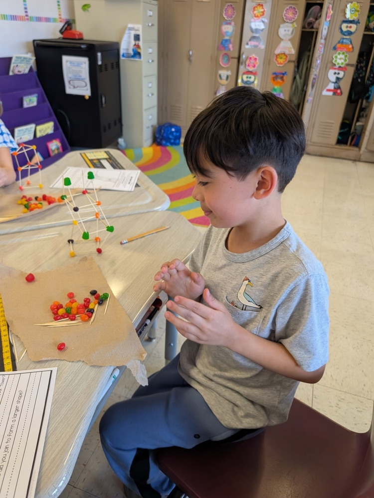 boy using jellybeans to make a creation