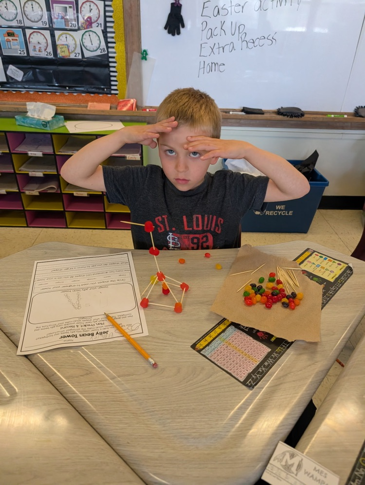 boy using jellybeans to make a creation