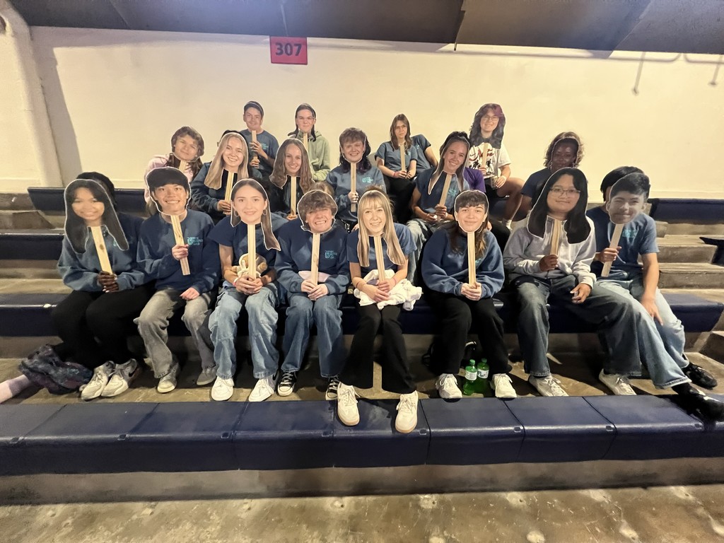 We had "big heads" made to cheer each other on during the Science Olympiad competition. University of Illinois 2026!